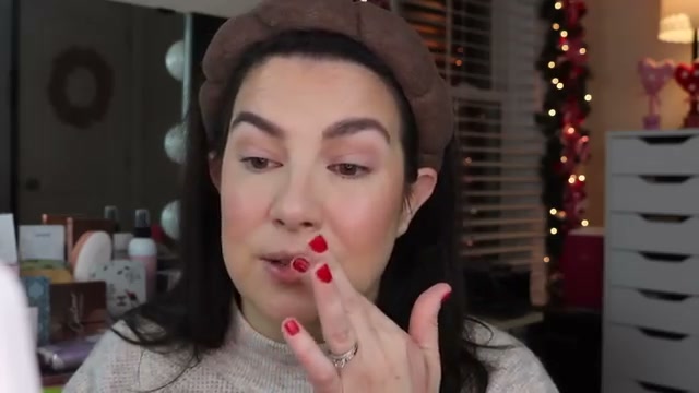 @emilynoel83 reviewing Le Mercerie Perfect Hydration Lip Gloss at 12:10 in a YouTube Shorts video