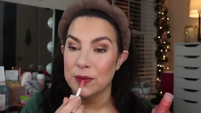 @emilynoel83 reviewing Maybelline Lifter Gloss at 16:58 in a YouTube Shorts video