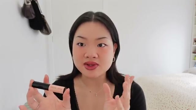@estherdaze reviewing Bobbi Brown Skin Corrector Stick at 06:13 in a YouTube Shorts video
