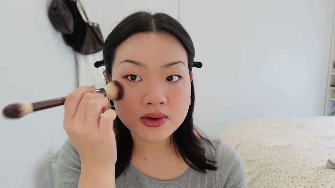 @estherdaze reviewing CHANEL Baume Essentiel Multi-Use Glow Stick Highlighter at 06:48 in a YouTube Shorts video