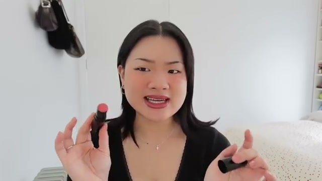 @estherdaze reviewing CHANEL Baume Essentiel Multi-Use Glow Stick at 02:59 in a YouTube Shorts video