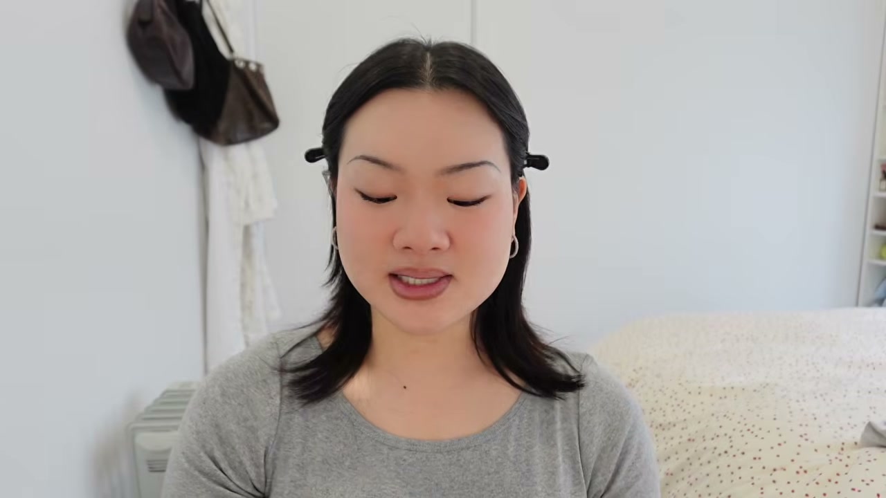 @estherdaze reviewing Charlotte Tilbury Airbrush Flawless Setting Spray at 06:07 in a YouTube Shorts video