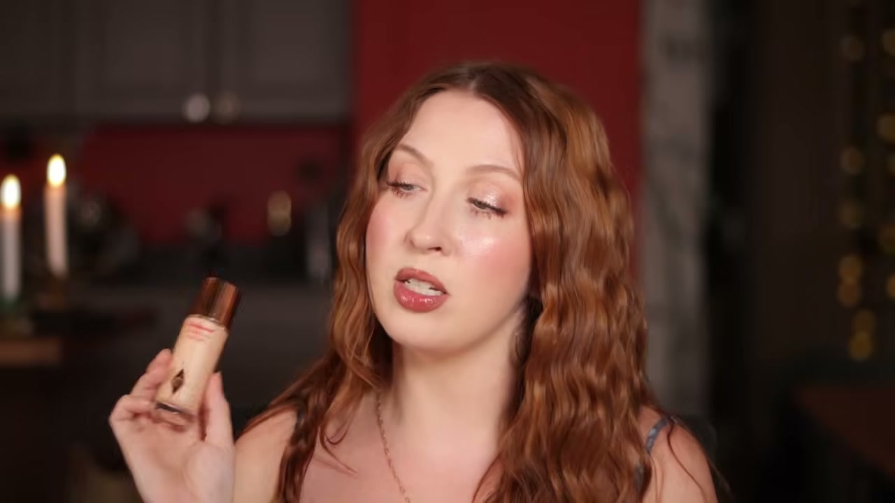 @evangelinemolly reviewing Charlotte Tilbury Hollywood Flawless Filter at 03:46 in a YouTube Shorts video