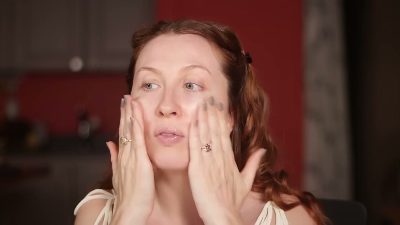@evangelinemolly reviewing Typology 9-Ingredient Moisturizer at 01:47 in a YouTube Shorts video