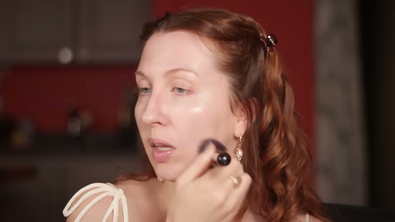 @evangelinemolly reviewing Typology Tinted Serum at 02:58 in a YouTube Shorts video