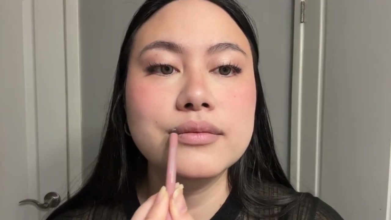 @girlythelazy reviewing Lise Watier Waterproof Lip Crayon at 04:10 in a YouTube Shorts video