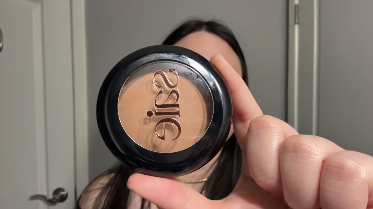 @girlythelazy reviewing Saie Super Suede Powder Bronzer at 04:36 in a YouTube Shorts video