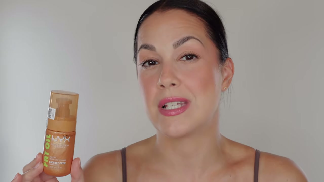 @glamourbylexi reviewing NYX Fat Oil Body Oil at 03:45 in a YouTube Shorts video