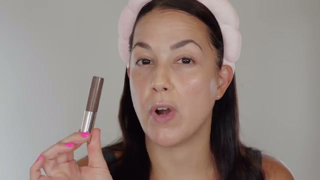@glamourbylexi reviewing Rare Beauty Tinted Brow Gel at 00:34 in a YouTube Shorts video