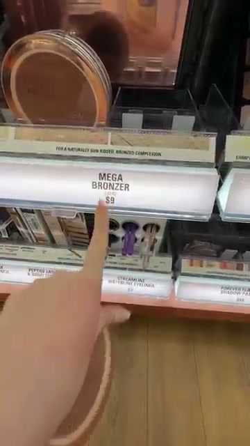 @itsbabykelz reviewing Makeup Revolution Mega Bronzer at 01:13 in a YouTube Shorts video