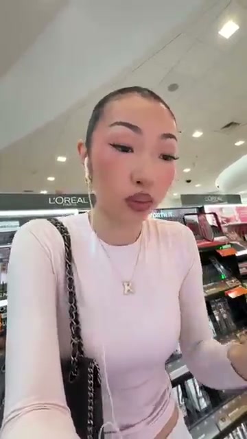 @itsbabykelz reviewing Makeup Revolution Pout Bomb Plumping Gloss at 02:04 in a YouTube Shorts video