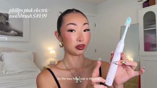 @itsbabykelz reviewing Phillips Electric Toothbrush at 09:01 in a YouTube Shorts video