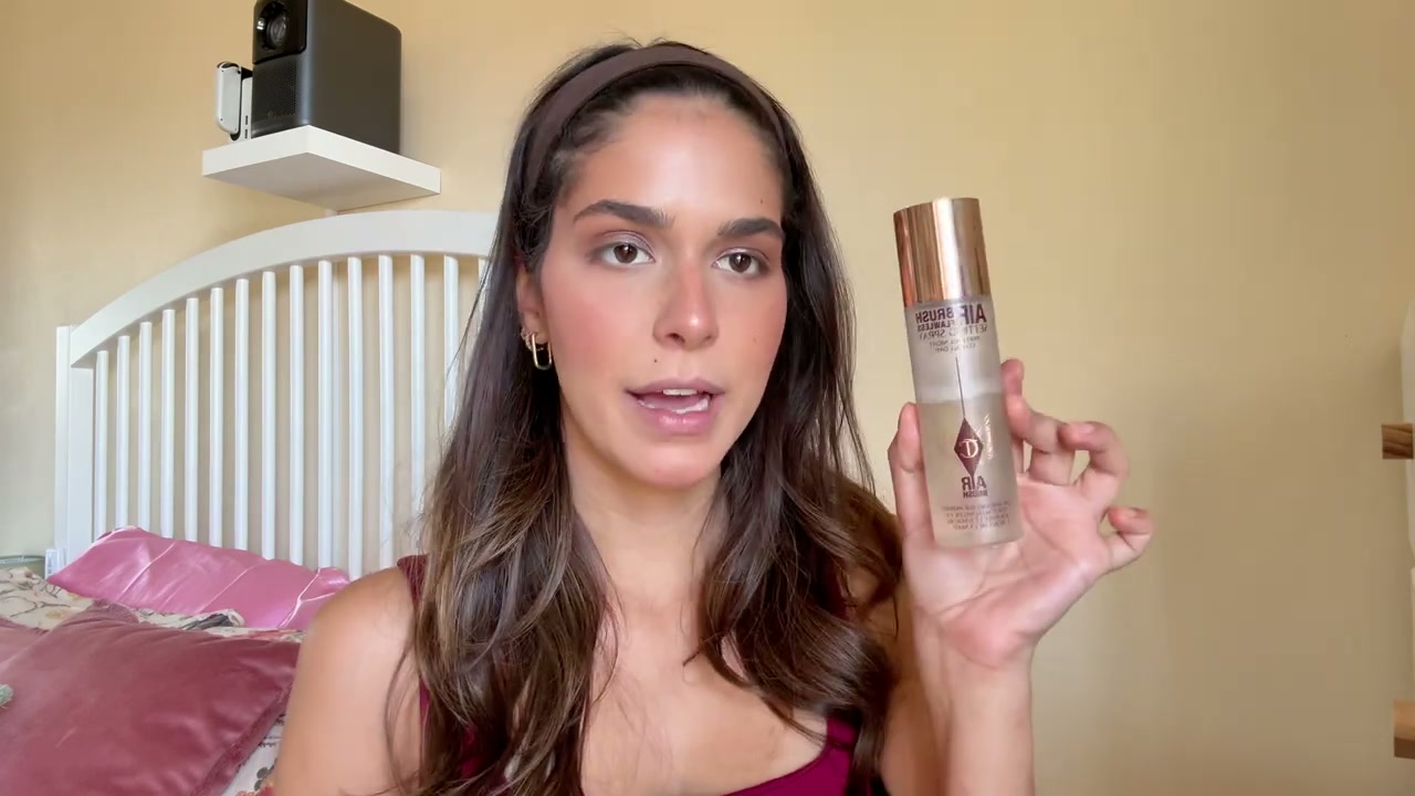 @itslifebycat reviewing Charlotte Tilbury Hair Brush Setting Spray at 11:14 in a YouTube Shorts video