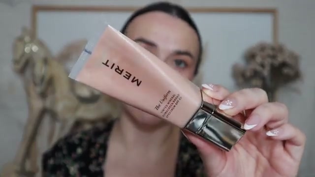 @jessicadeerly reviewing Merit The Uniform at 06:24 in a YouTube Shorts video
