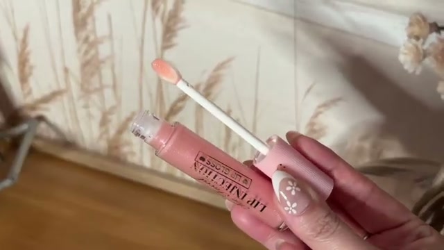 @jessicadeerly reviewing Too Faced Lip Injection Lip Gloss Cooling Instant Lip Plumper at 54:23 in a YouTube Shorts video