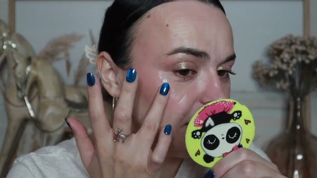 @jessicadeerly reviewing Wet n Wild My Melody Glitter Gel at 24:47 in a YouTube Shorts video