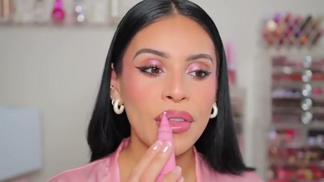@juicyjas reviewing Catrice Peptide Bliss Glossy Lip Balm at 27:12 in a YouTube Shorts video