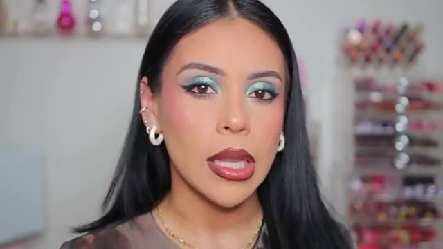 @juicyjas reviewing Catrice Peptide Bliss Glossy Lip Balm at 15:13 in a YouTube Shorts video