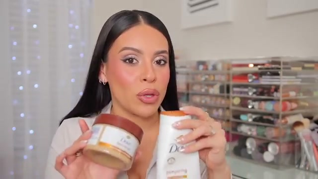 @juicyjas reviewing Dove Brown Sugar & Coconut Butter Body Scrub at 02:52 in a YouTube Shorts video