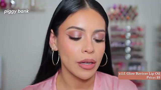 @juicyjas reviewing e.l.f. Cosmetics Glow Reviver Lip Oil at 15:01 in a YouTube Shorts video