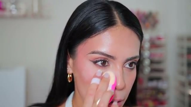 @juicyjas reviewing e.l.f. Cosmetics Set It Bright Setting Powder at 15:23 in a YouTube Shorts video