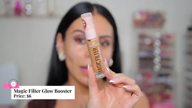 @juicyjas reviewing Essence Magic Filter Glow Booster at 05:07 in a YouTube Shorts video