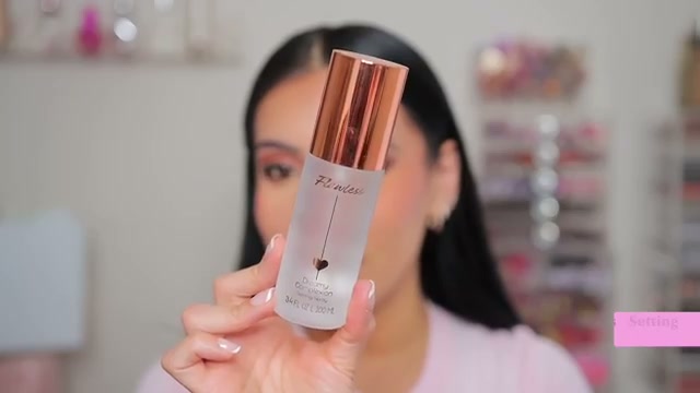 @juicyjas reviewing Flawless Setting Spray at 15:13 in a YouTube Shorts video