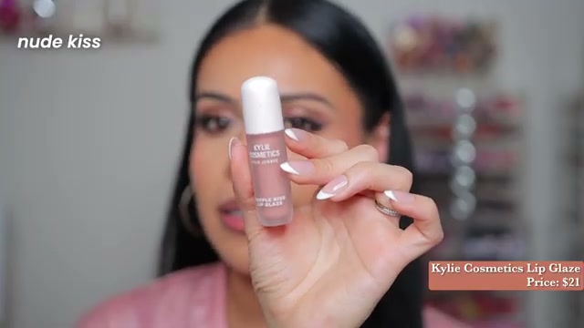 @juicyjas reviewing Kylie Cosmetics Supple Kiss Lip Gloss at 10:44 in a YouTube Shorts video