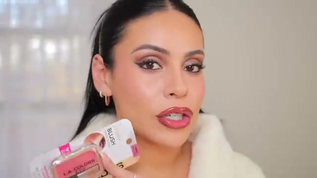 @juicyjas reviewing L.A. Colors Powder Blush at 15:30 in a YouTube Shorts video