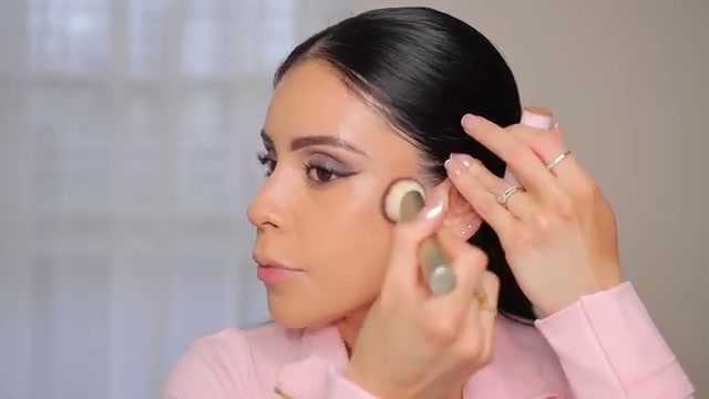 @juicyjas reviewing Makeup Revolution Skin Silk Bronzer Stick at 19:37 in a YouTube Shorts video