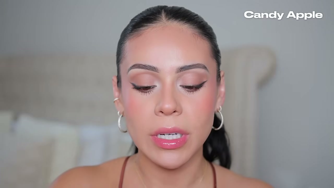 @juicyjas reviewing Milani Fruit Fetish Lip Oils at 14:34 in a YouTube Shorts video