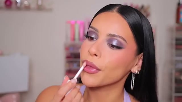 @juicyjas reviewing Milk Makeup Lip Oil Gloss at 12:01 in a YouTube Shorts video