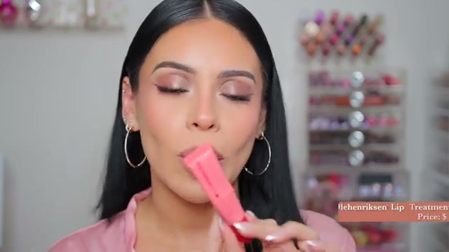 @juicyjas reviewing Ole Henriksen Pout Preserve Lip Treatment at 01:33 in a YouTube Shorts video
