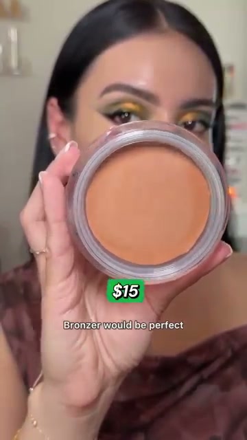 @juicyjas reviewing Physicians Formula Bronze Booster Cream Bronzer at 01:08 in a YouTube Shorts video