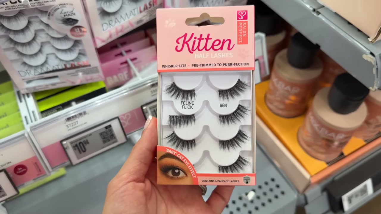 @juicyjas reviewing Salon Perfect Kitten Half Lash 664 4 Pack at 06:47 in a YouTube Shorts video