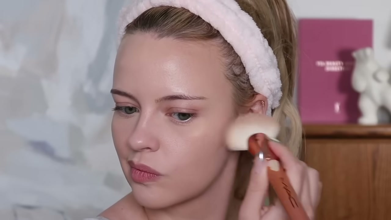 @juliaadamsmua reviewing BASMA Beauty Powder Bronzer at 08:34 in a YouTube Shorts video