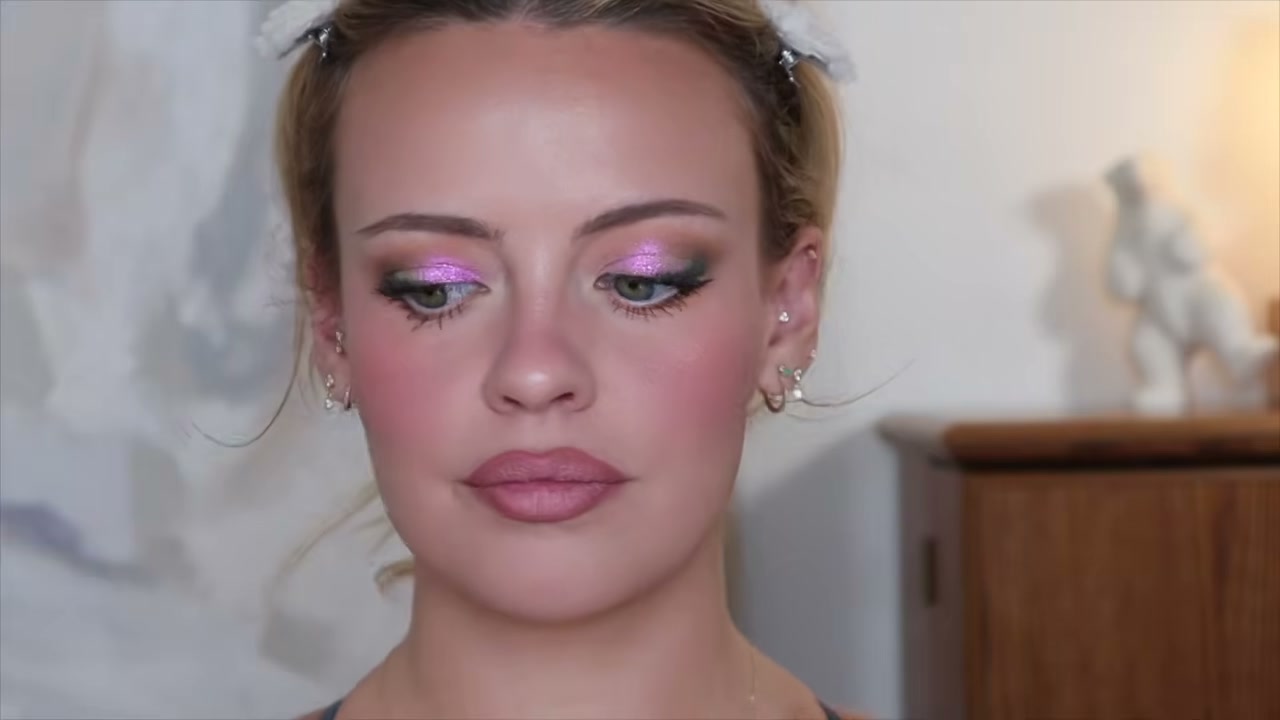 @juliaadamsmua reviewing Huda Beauty Liquid Matte Mousse Soft Blur Lip Cream at 22:15 in a YouTube Shorts video