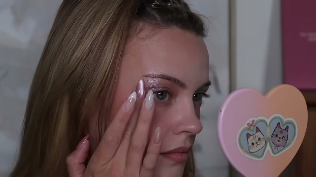 @juliaadamsmua reviewing Marc Jacobs Beauty Money Shot Gel Highlighter at 22:07 in a YouTube Shorts video