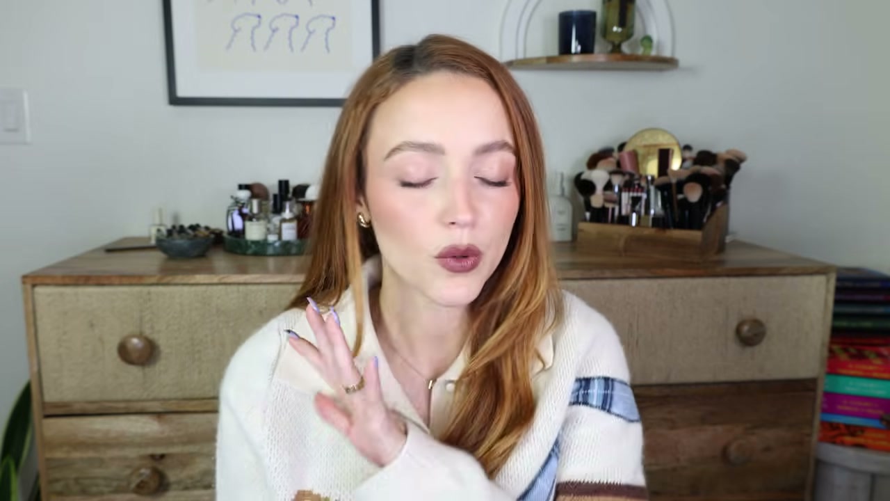 @kathleenlights reviewing CHANEL Baume Essentiel Multi-Use Stick at 10:27 in a YouTube Shorts video