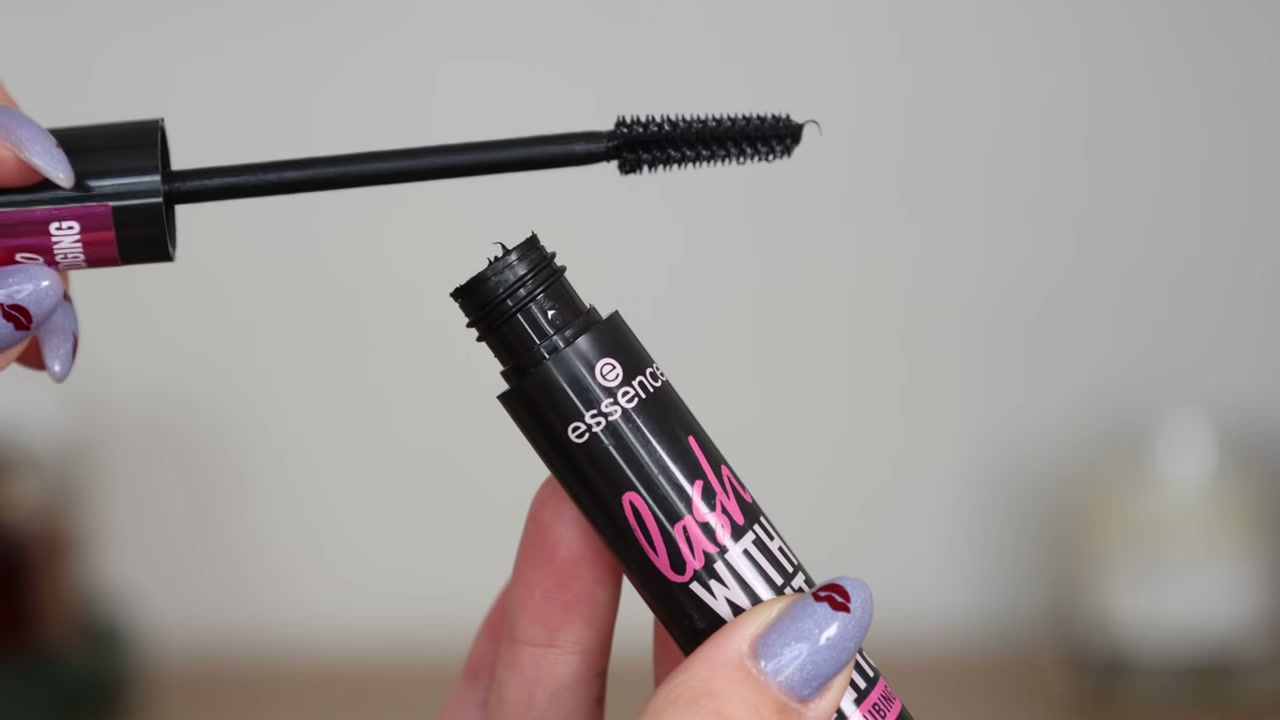 @kathleenlights reviewing Essence Lash Without Limits Tubing Extreme Lengthening Mascara at 06:06 in a YouTube Shorts video