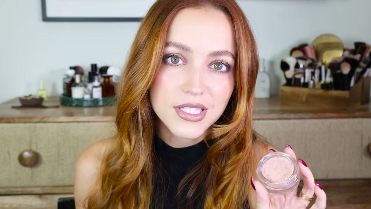 @kathleenlights reviewing Half Magic Glitter Puck Pressed Fairy Dust Eyes, Face + Body at 05:25 in a YouTube Shorts video
