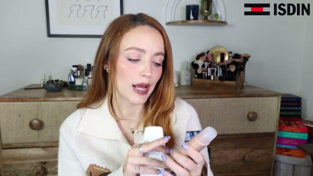 @kathleenlights reviewing ISDIN Fusion Water Magic SPF 50 at 01:53 in a YouTube Shorts video