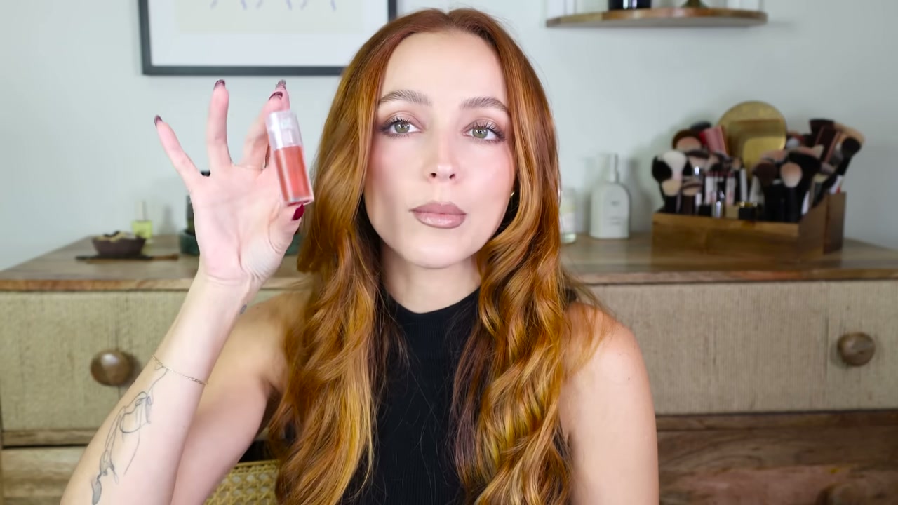 @kathleenlights reviewing Kaja Juicy Glass Lip Oil at 02:35 in a YouTube Shorts video