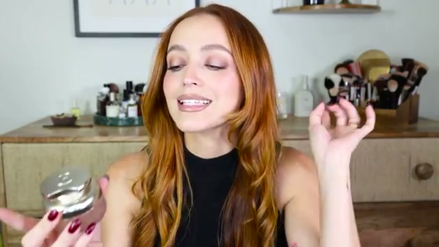 @kathleenlights reviewing Rare Beauty Eau De Parfum at 13:07 in a YouTube Shorts video