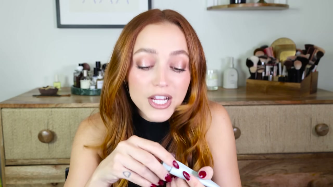 @kathleenlights reviewing Rare Beauty Fragrance Layering Balm at 14:04 in a YouTube Shorts video