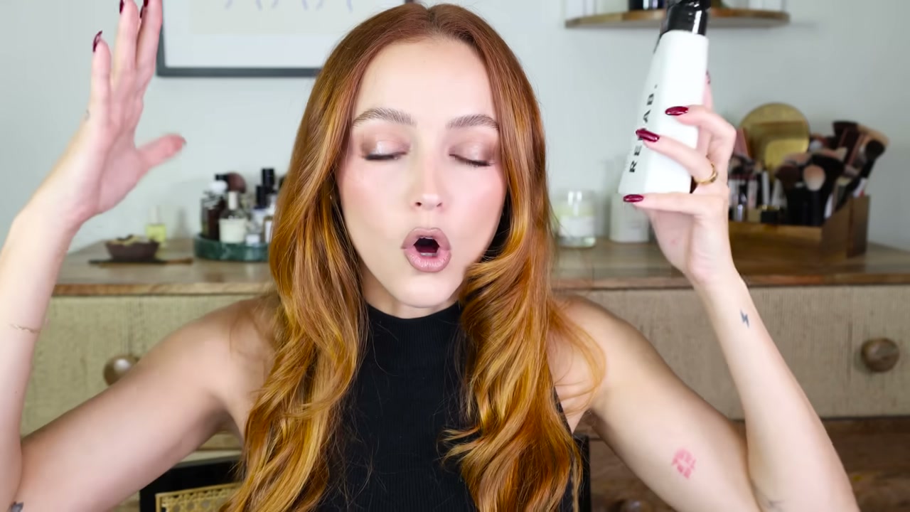 @kathleenlights reviewing Rehab. Essential Hair Spray at 11:45 in a YouTube Shorts video