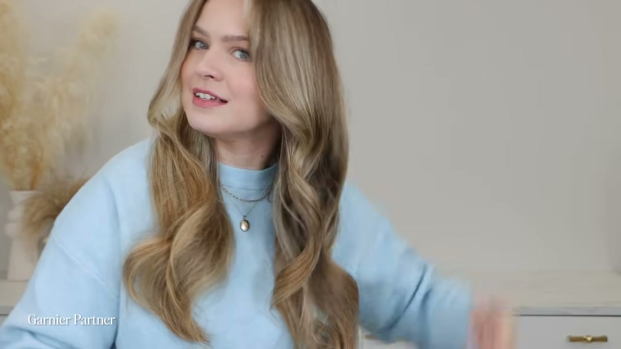 @kayleymelissa reviewing Garnier Fructis Sleek & Shine Anti-Frizz Serum at 08:24 in a YouTube Shorts video