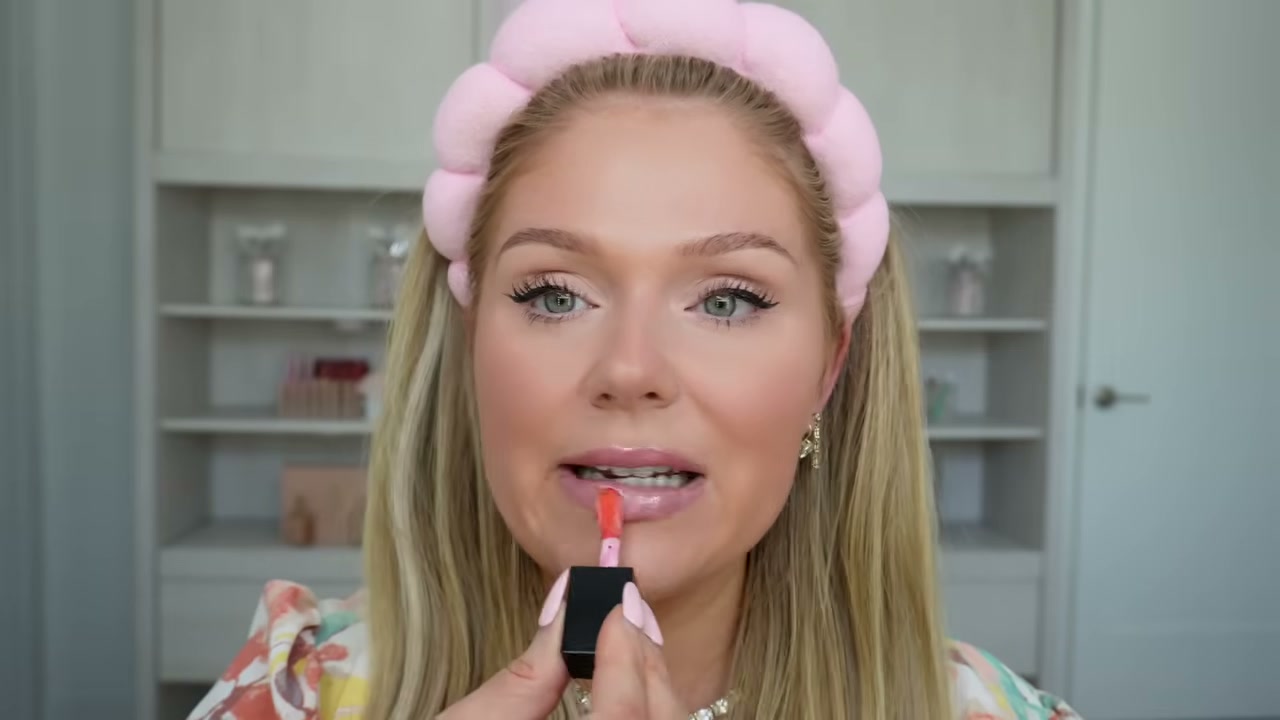 @kellystrack reviewing e.l.f. Cosmetics Glow Reviver Lip Oil at 14:12 in a YouTube Shorts video