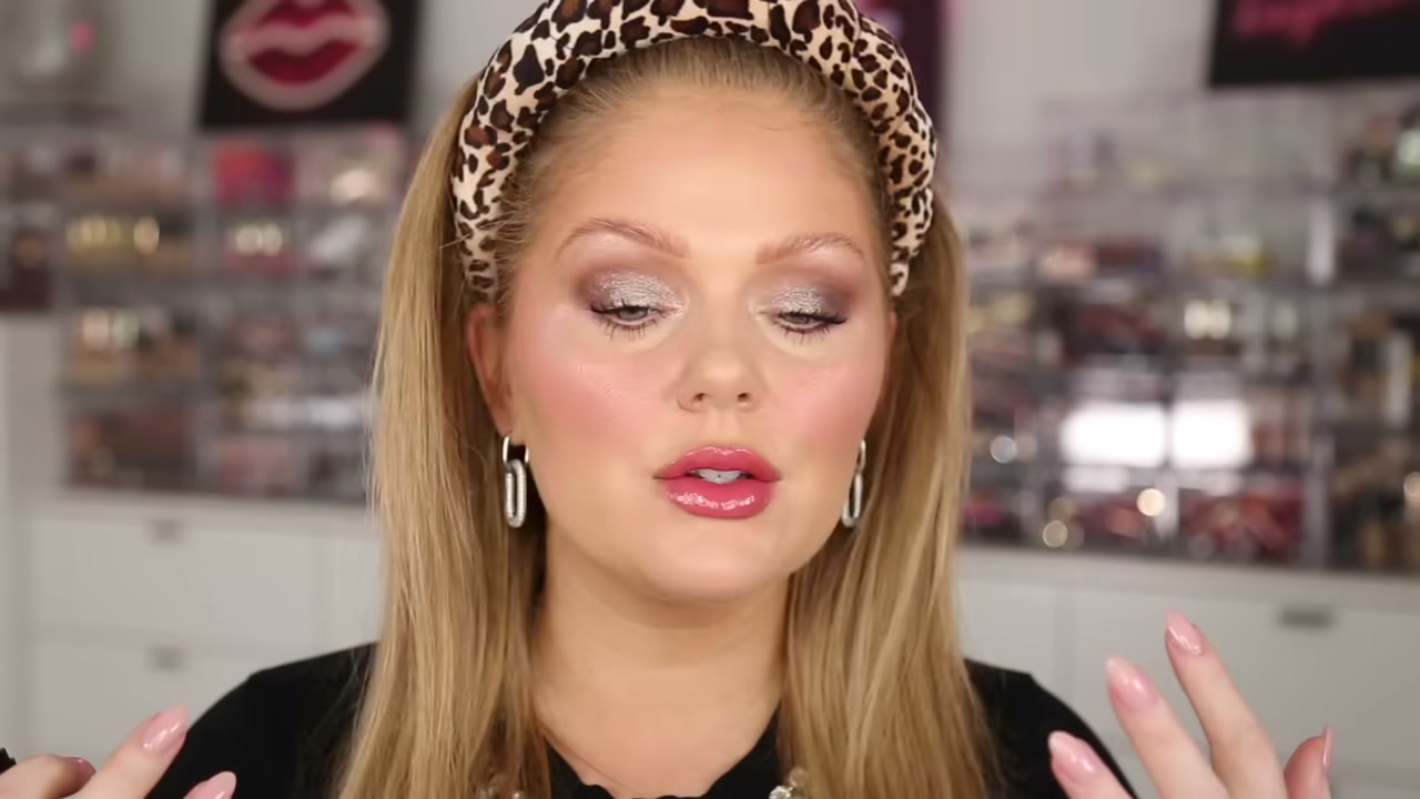 @kellystrack reviewing Hard Candy Glow on Lock Illuminating Setting Spray at 14:28 in a YouTube Shorts video