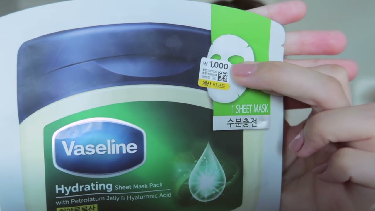 @krystallee reviewing Vaseline Nourishing Sheet Mask at 03:02 in a YouTube Shorts video
